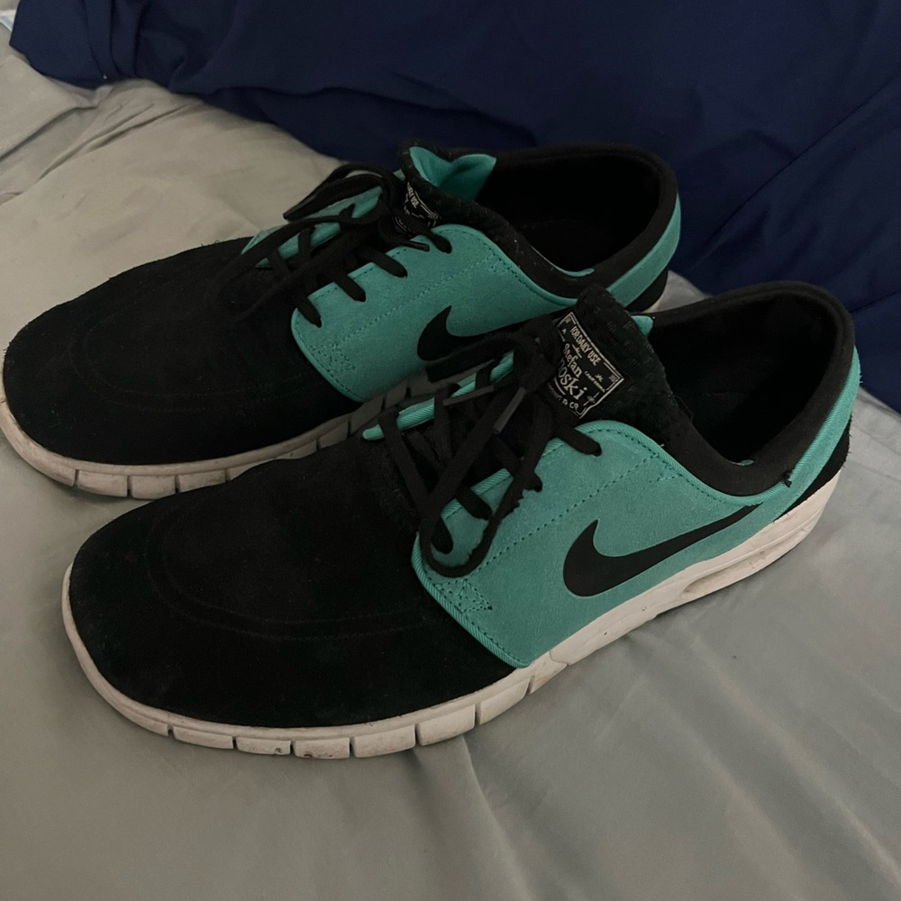 Black and teal Nike